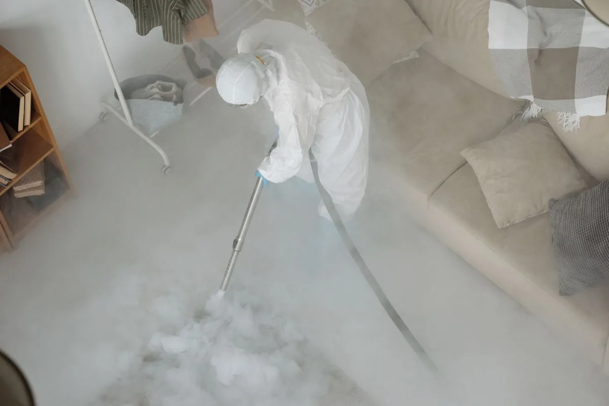 Biohazard cleanup technician in protective equipment, Star City, WV